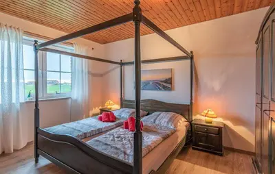 Ein Bett oder Betten in einem Zimmer der Unterkunft Haus Deichgraf