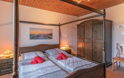 Ein Bett oder Betten in einem Zimmer der Unterkunft Haus Deichgraf
