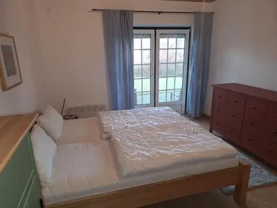 Ein Bett oder Betten in einem Zimmer der Unterkunft Deichkieker