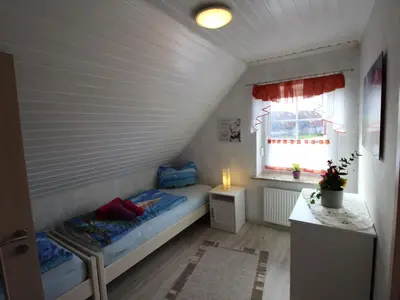 Ein Bett oder Betten in einem Zimmer der Unterkunft Apartment FeWo Strandläufer by Interhome