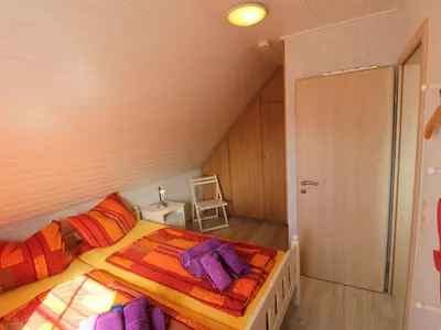 Ein Bett oder Betten in einem Zimmer der Unterkunft Apartment FeWo Strandläufer by Interhome