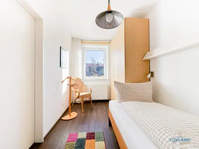 Ein Bett oder Betten in einem Zimmer der Unterkunft Ferienwohnung 19 Heinrich-Grube Weg