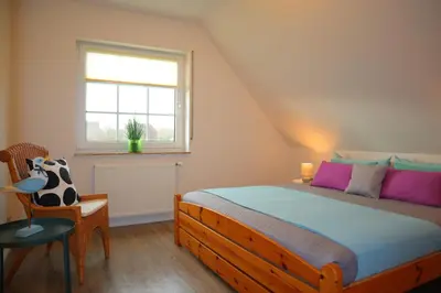 Ein Bett oder Betten in einem Zimmer der Unterkunft Ferienhaus Perlmuschel