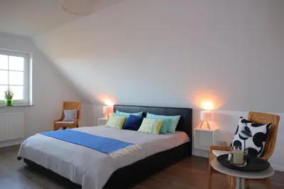 Ein Bett oder Betten in einem Zimmer der Unterkunft Ferienhaus Perlmuschel