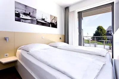 Ein Bett oder Betten in einem Zimmer der Unterkunft Alte Liebe, RA211