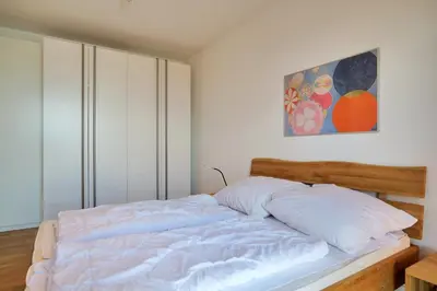 Ein Bett oder Betten in einem Zimmer der Unterkunft Haus Yachthafen, KY7
