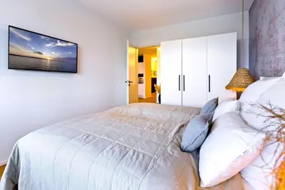 Ein Bett oder Betten in einem Zimmer der Unterkunft Duhner Spitze, DS5