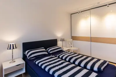 Ein Bett oder Betten in einem Zimmer der Unterkunft Haus Yachthafen, KY2