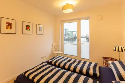 Ein Bett oder Betten in einem Zimmer der Unterkunft Haus Yachthafen, KY2