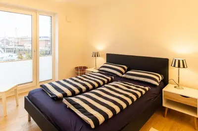 Ein Bett oder Betten in einem Zimmer der Unterkunft Haus Yachthafen, KY2