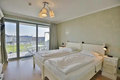 Ein Bett oder Betten in einem Zimmer der Unterkunft Residenz am Yachthafen, RY28