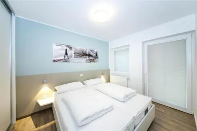 Ein Bett oder Betten in einem Zimmer der Unterkunft Duhner Brandung, B2