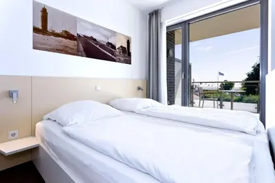 Ein Bett oder Betten in einem Zimmer der Unterkunft Alte Liebe, RA209