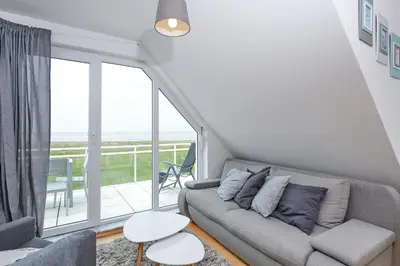 Ein Sitzbereich in der Unterkunft Dünenweg 19, HD6