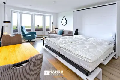 Ein Bett oder Betten in einem Zimmer der Unterkunft Nordseeperle, NP7