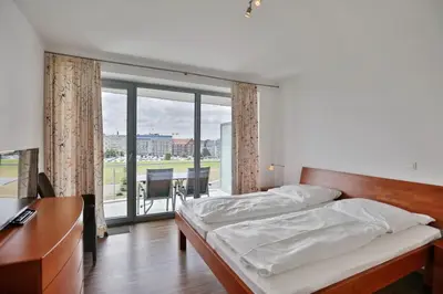 Ein Bett oder Betten in einem Zimmer der Unterkunft Residenz am Yachthafen, RY22