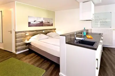 Ein Bett oder Betten in einem Zimmer der Unterkunft Duhner Strandhus, S12