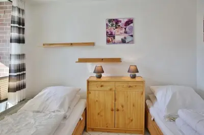 Ein Bett oder Betten in einem Zimmer der Unterkunft Hohe Worth, H106