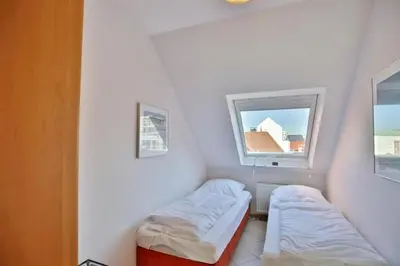 Ein Bett oder Betten in einem Zimmer der Unterkunft Duhner Brise, DB6