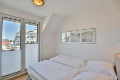 Ein Bett oder Betten in einem Zimmer der Unterkunft Duhner Brise, DB6