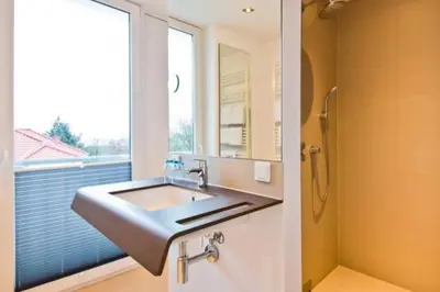 Ein Badezimmer in der Unterkunft Duhner Strandhus, S302