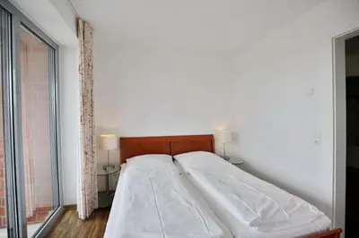 Ein Bett oder Betten in einem Zimmer der Unterkunft Residenz am Yachthafen, RY24