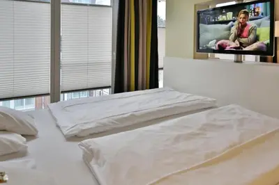 Ein Bett oder Betten in einem Zimmer der Unterkunft Duhner Strandhus, S204
