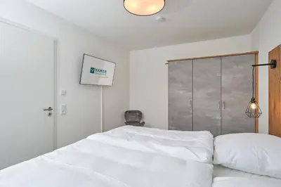 Ein Bett oder Betten in einem Zimmer der Unterkunft Nordstrand, N304