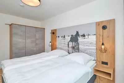 Ein Bett oder Betten in einem Zimmer der Unterkunft Nordstrand, N304