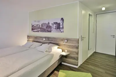 Ein Bett oder Betten in einem Zimmer der Unterkunft Duhner Strandhus, S108