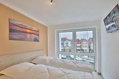 Ein Bett oder Betten in einem Zimmer der Unterkunft City Marina, CM24c