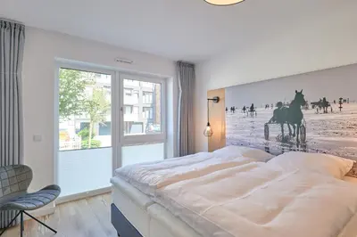 Ein Bett oder Betten in einem Zimmer der Unterkunft Nordstrand, N103