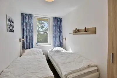 Ein Bett oder Betten in einem Zimmer der Unterkunft Hohe Worth, H313