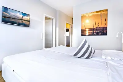 Ein Bett oder Betten in einem Zimmer der Unterkunft Döser Seedeich 7, SD9