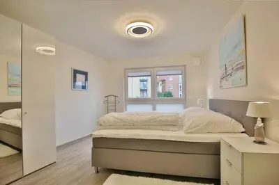 Ein Bett oder Betten in einem Zimmer der Unterkunft City Marina, CM18-4