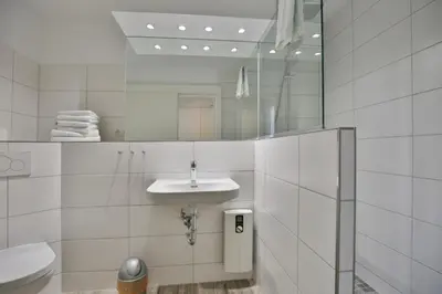 Ein Badezimmer in der Unterkunft Hohe Worth, H304