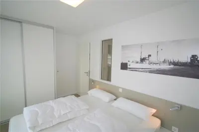 Ein Bett oder Betten in einem Zimmer der Unterkunft Duhner Brandung, B9
