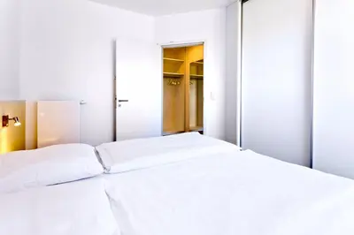 Ein Bett oder Betten in einem Zimmer der Unterkunft Alte Liebe, RA206