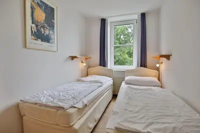 Ein Bett oder Betten in einem Zimmer der Unterkunft Hohe Worth, H212
