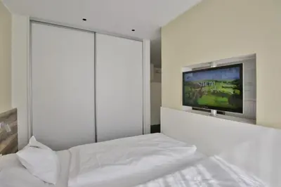 Ein Bett oder Betten in einem Zimmer der Unterkunft Duhner Strandhus, S3