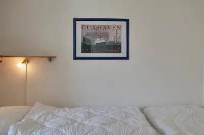 Ein Bett oder Betten in einem Zimmer der Unterkunft Hohe Worth, H8