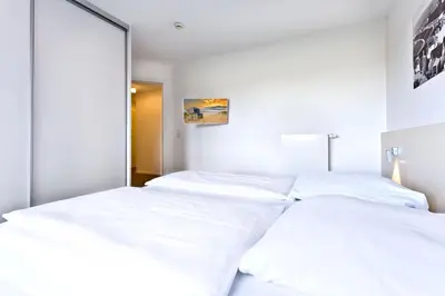Ein Bett oder Betten in einem Zimmer der Unterkunft Alte Liebe, RA106