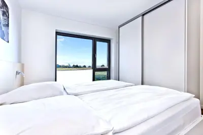 Ein Bett oder Betten in einem Zimmer der Unterkunft Alte Liebe, RA106