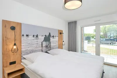 Ein Bett oder Betten in einem Zimmer der Unterkunft Nordstrand, N102