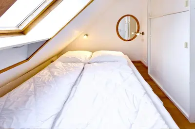 Ein Bett oder Betten in einem Zimmer der Unterkunft Stranddüne, D22
