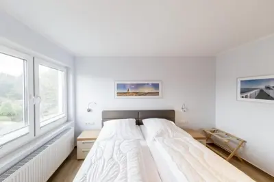 Ein Bett oder Betten in einem Zimmer der Unterkunft Admiralsgarten, AG9b