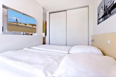 Ein Bett oder Betten in einem Zimmer der Unterkunft Alte Liebe, RA109