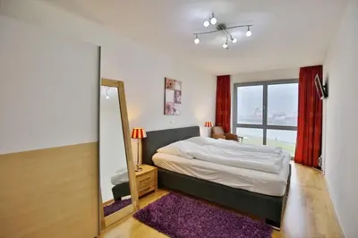 Ein Bett oder Betten in einem Zimmer der Unterkunft Residenz am Yachthafen, RY14