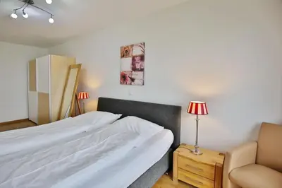 Ein Bett oder Betten in einem Zimmer der Unterkunft Residenz am Yachthafen, RY14