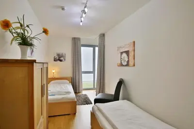 Ein Bett oder Betten in einem Zimmer der Unterkunft Residenz am Yachthafen, RY14